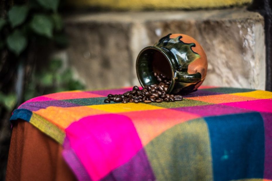 Photo by Bruno Cervera: https://www.pexels.com/photo/brown-and-black-ceramic-coffee-bean-rack-on-pink-green-and-yellow-textile-187932/